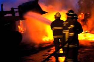 Firefighters putting out industrial fire